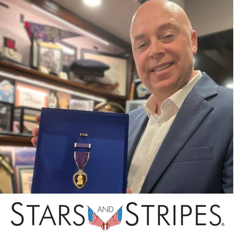 Kevin Kline holding Purple Heart